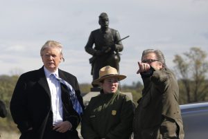 Republican U.S. presidential nominee Donald Trump (C) and campaign CEO Steve Bannon (R) listen to National Park Service Interpretive Park Ranger Caitlin Kostic (2nd R) on a brief visit to Gettysburg National Military Park in Gettysburg, Pennsylvania, U.S. October 22, 2016. REUTERS/Jonathan Ernst - RTX2Q0OQ