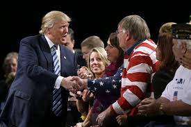 Trump shakes hands with one of his supporters. Image credit: http://www.wsj.com/articles/trump-rides-a-blue-collar-wave-1447803248