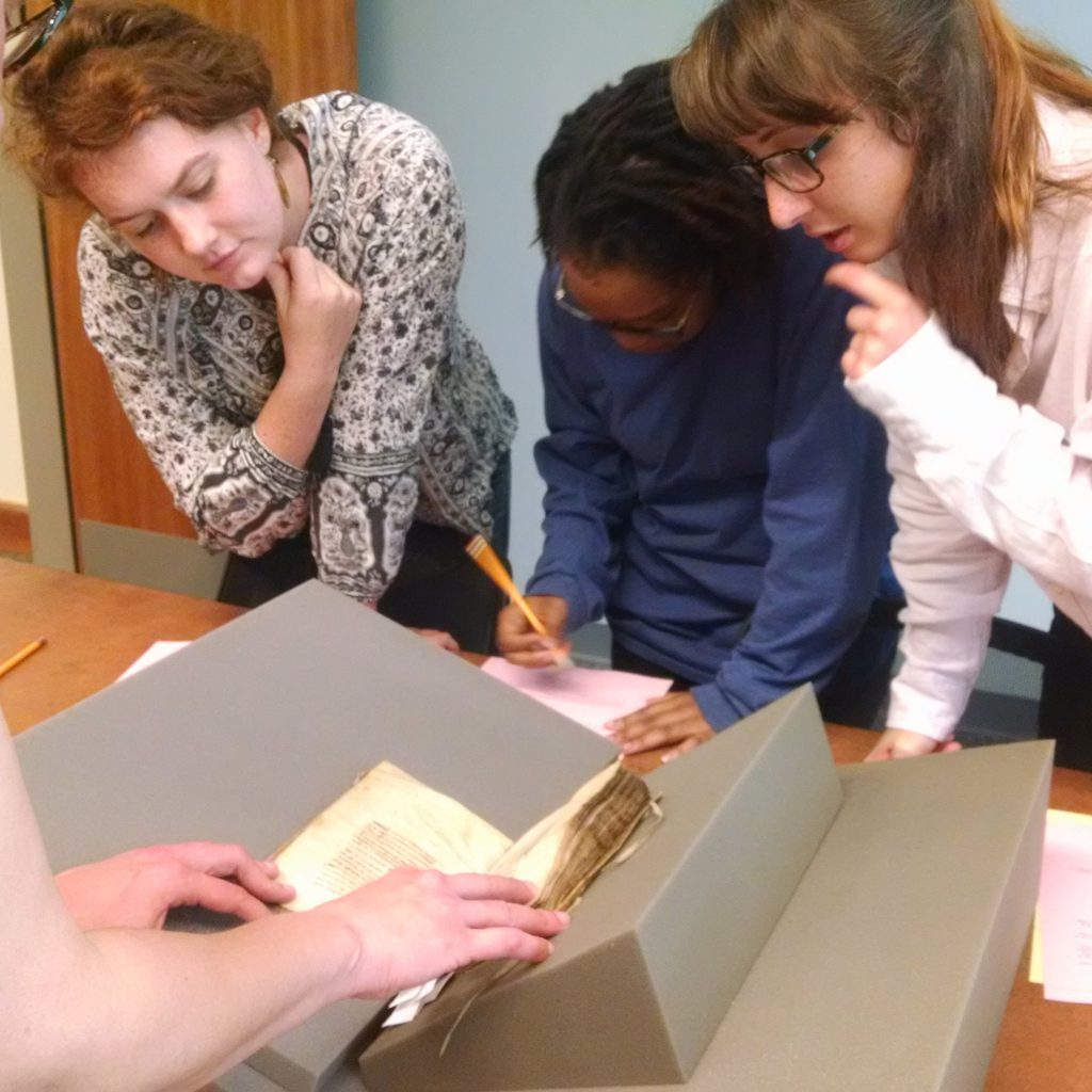 Students examine the Hargrett Hours