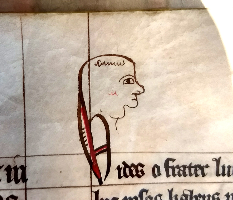 Decorative initial with face