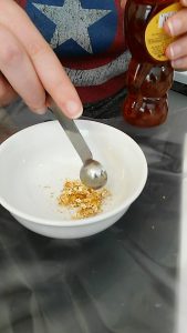 our attempt at mixing crushed gold leaf into a paste by adding honey (in a ramikin)