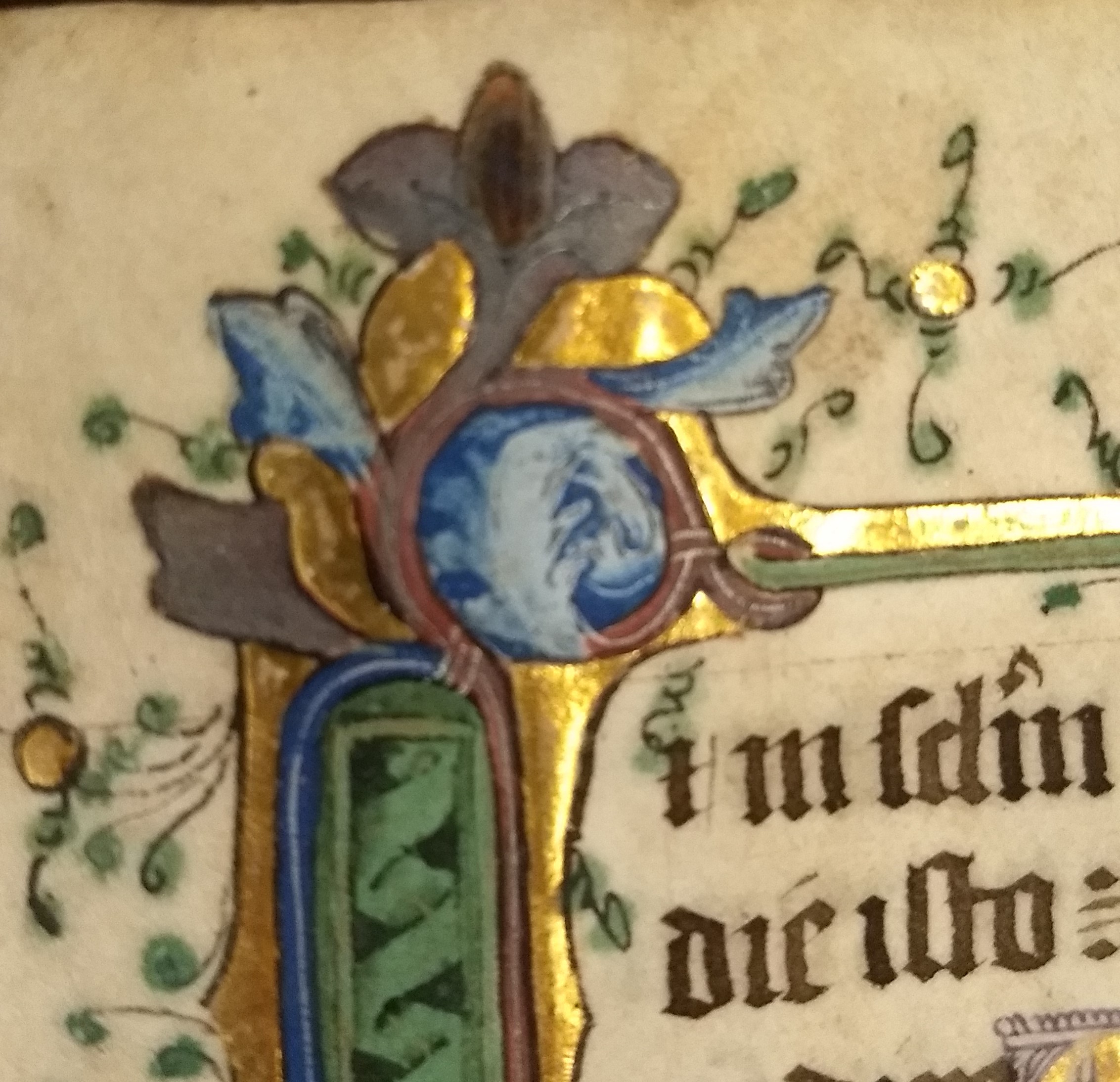 A whimsical face in the border of a manuscript page