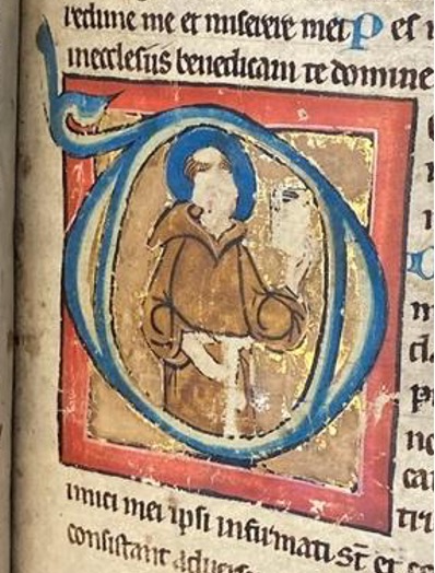Medieval initial showing Saint Francis. The saint's face, hand, and the book he is holding have been damaged.