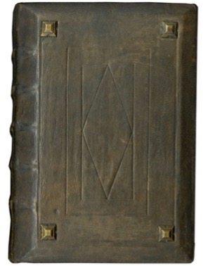 Leather cover with metal bosses and a geometric design