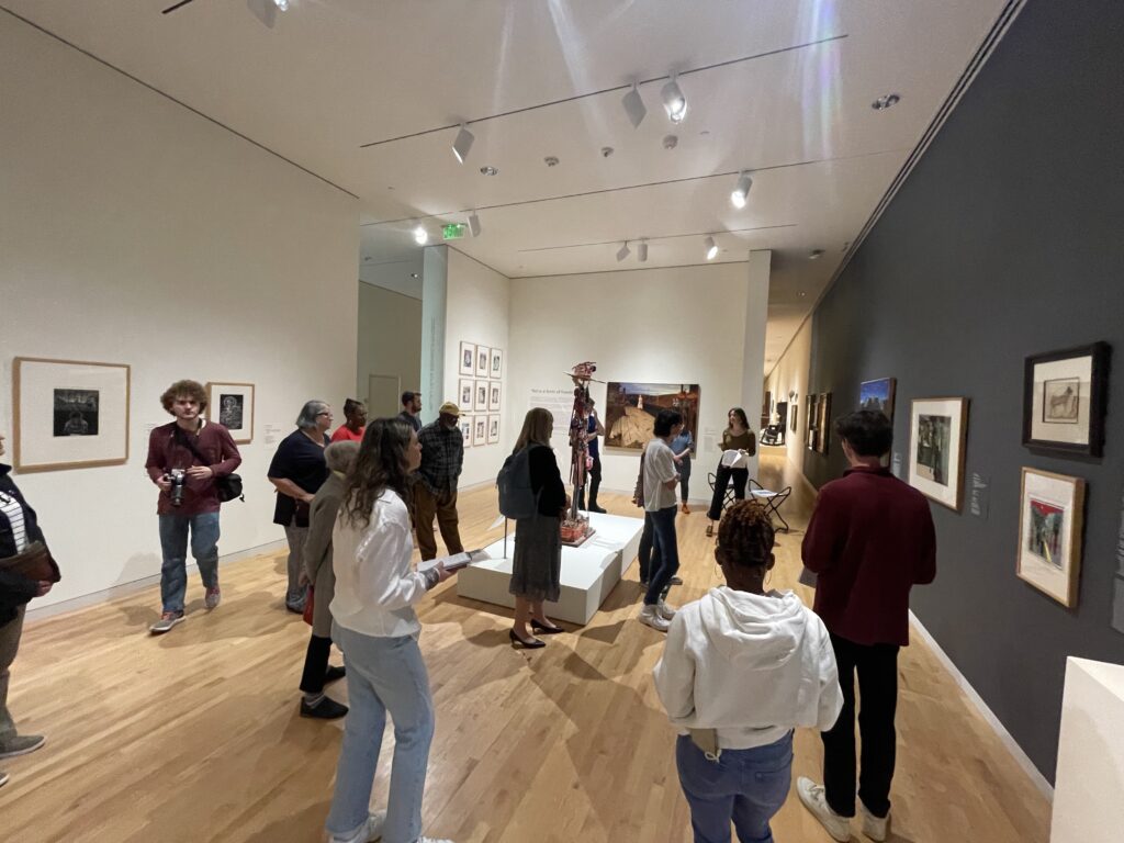 People listening to Callan Steinmann in the Art is a form of Freedom exhibit. Photo Courtesy by Sarah Sims
